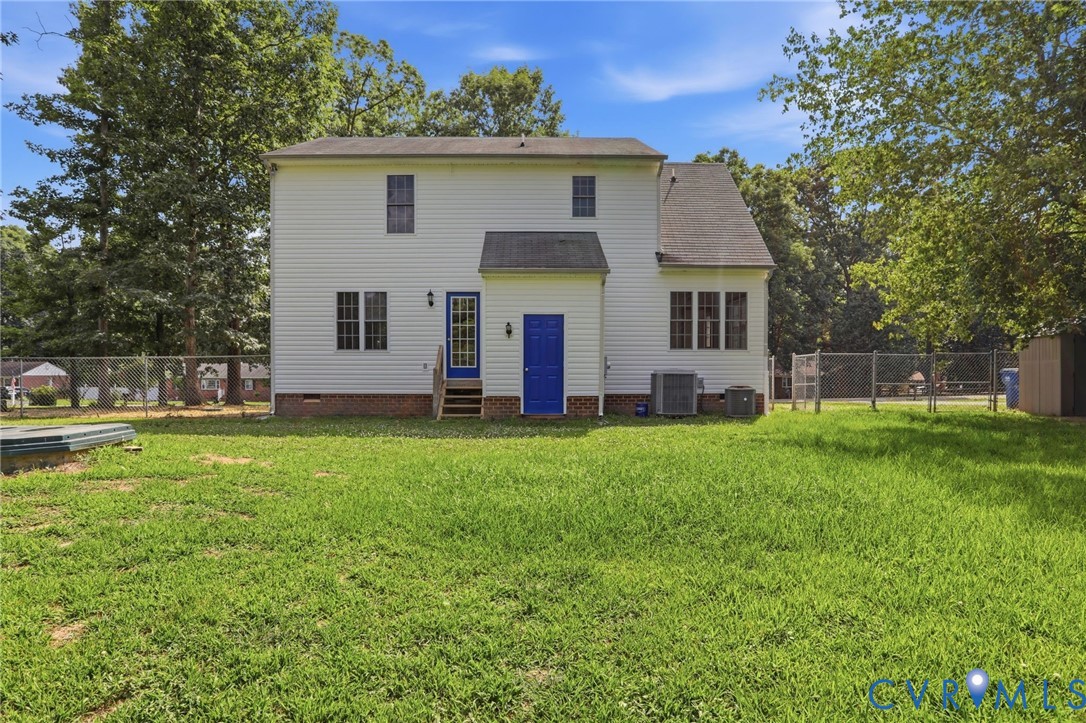 14420 Branding Iron Road Chesterfield, VA 23838 - Photo 40 of 50 Expansive rear yard featuring a two-story residenc