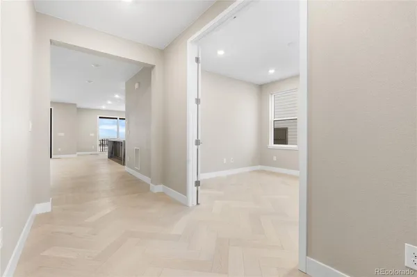 a view of a hallway with wooden shelves