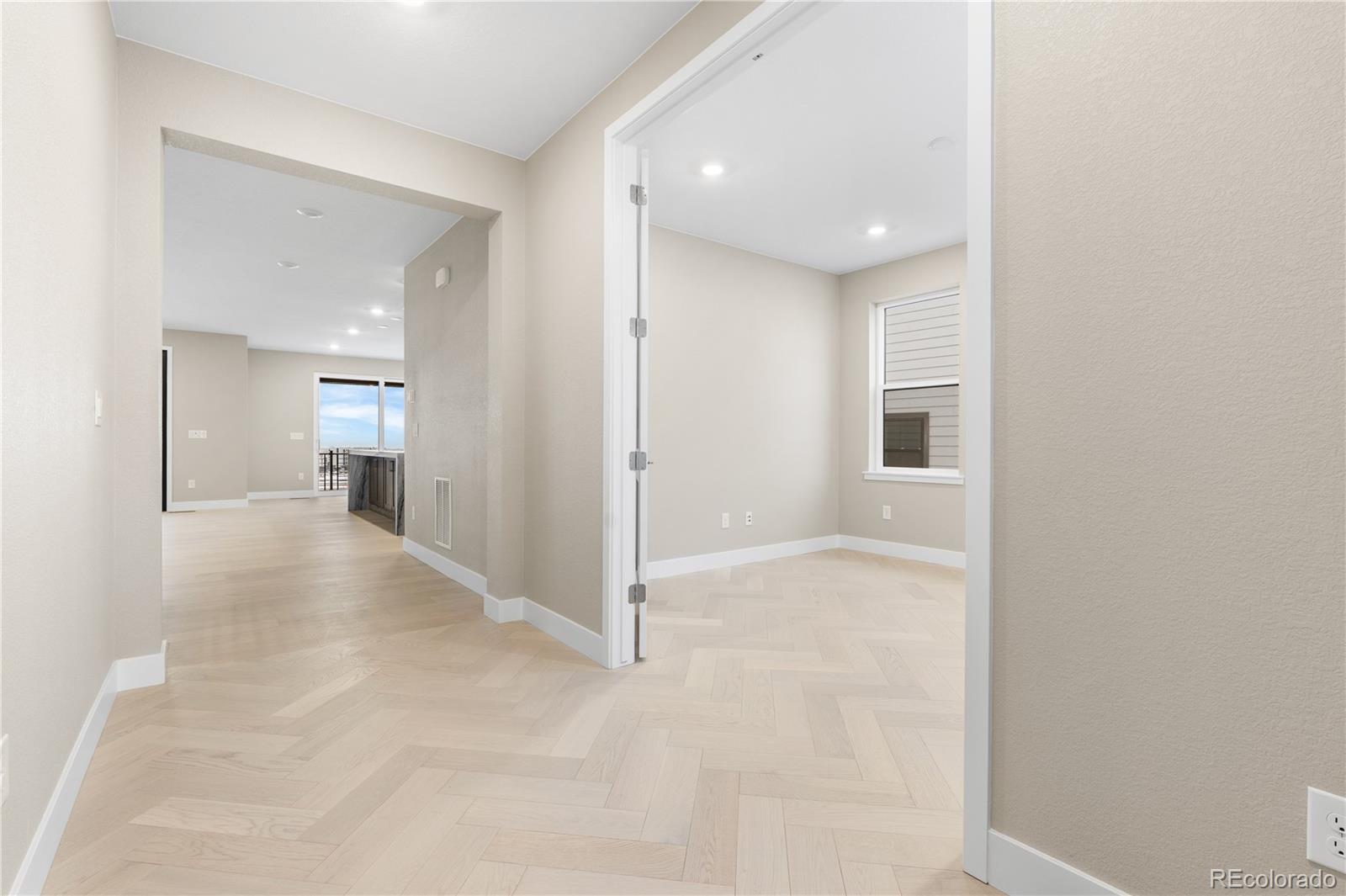 11293 Tenor Trail Lone Tree, CO 80134 - Photo 24 of 50 a view of a hallway with wooden shelves