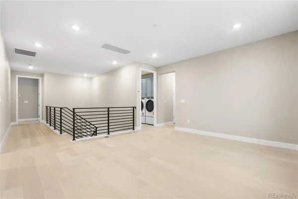 an empty room with wooden floor