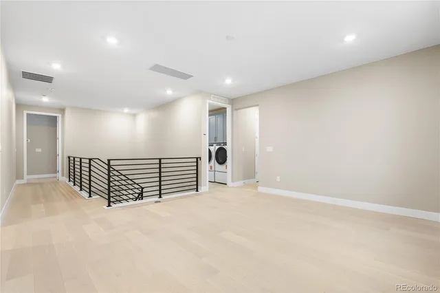 an empty room with wooden floor