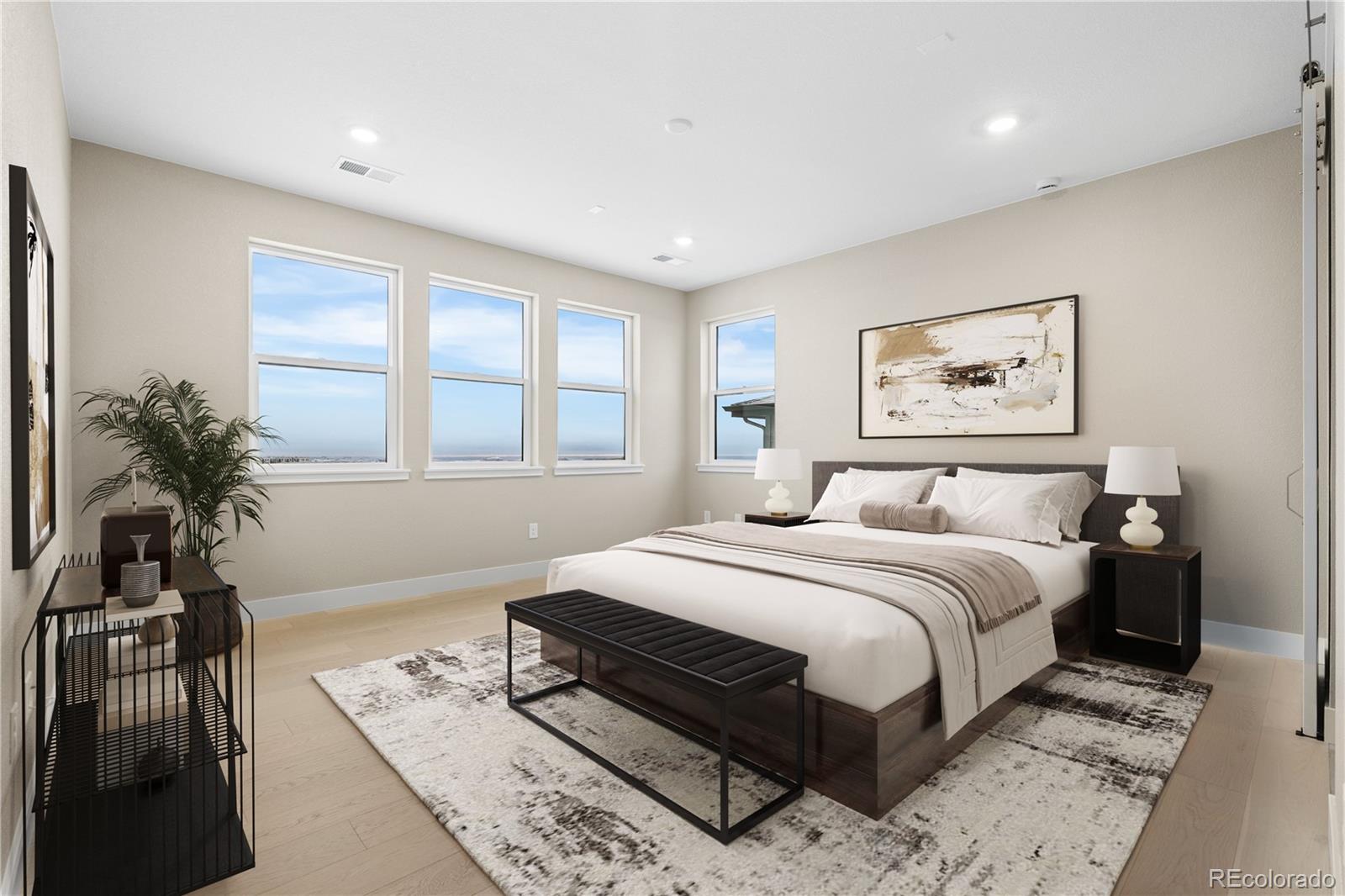 11293 Tenor Trail Lone Tree, CO 80134 - Photo 35 of 50 a bedroom with a large bed and a window