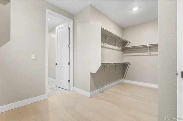 an empty room with wooden floor