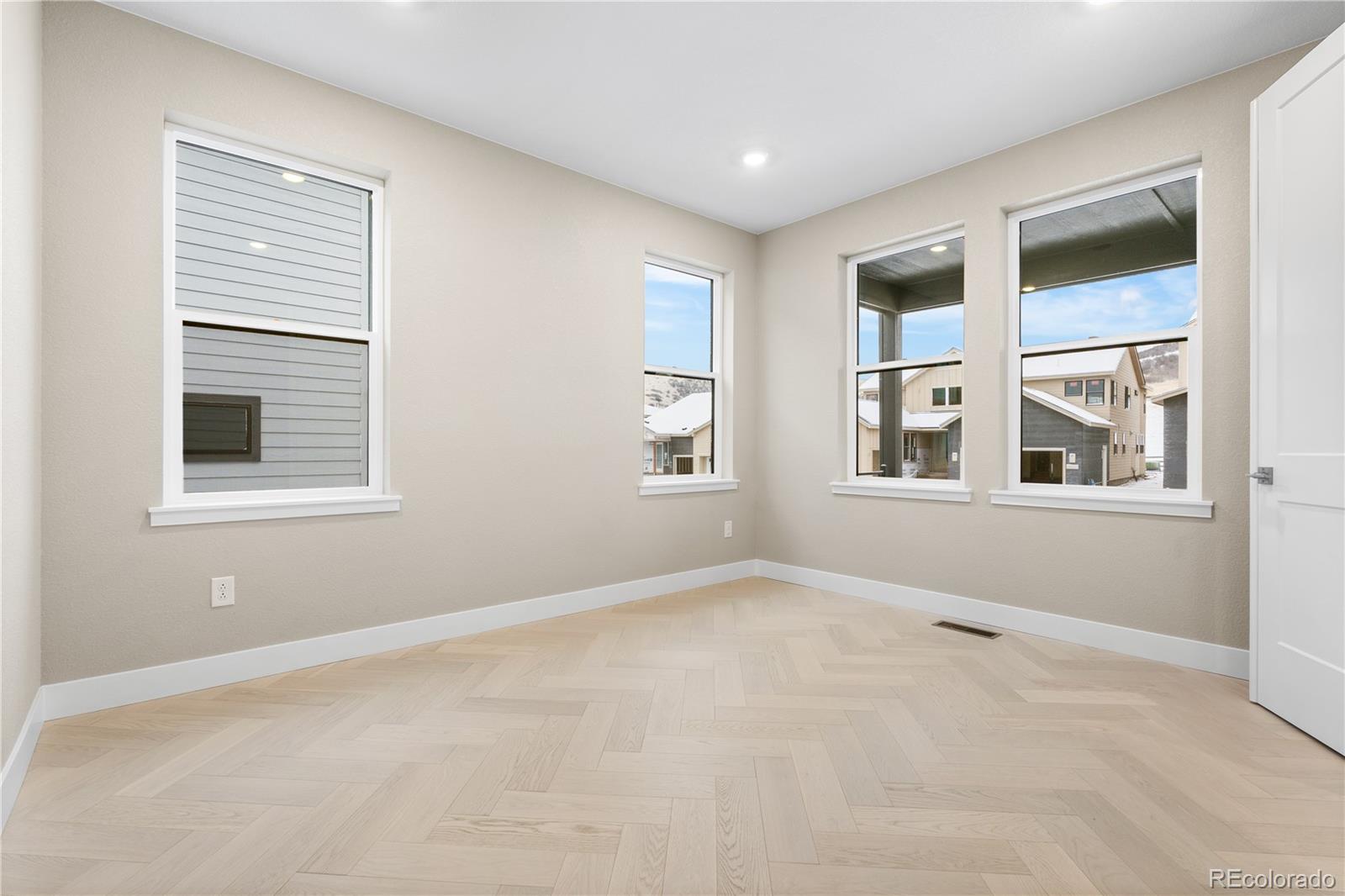 11293 Tenor Trail Lone Tree, CO 80134 - Photo 40 of 50 a view of an empty room with a window
