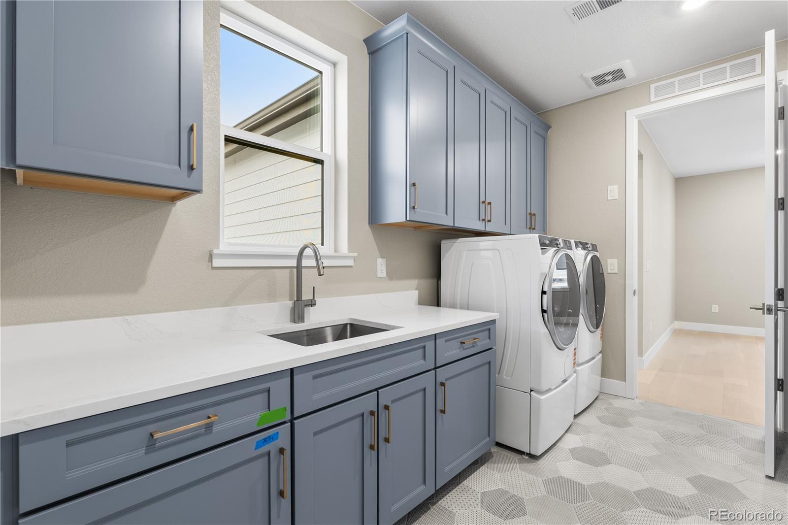 11293 Tenor Trail Lone Tree, CO 80134 - Photo 41 of 50 a kitchen with a sink and cabinets