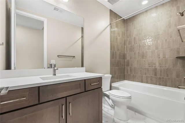 a bathroom with a sink a toilet and a bathtub