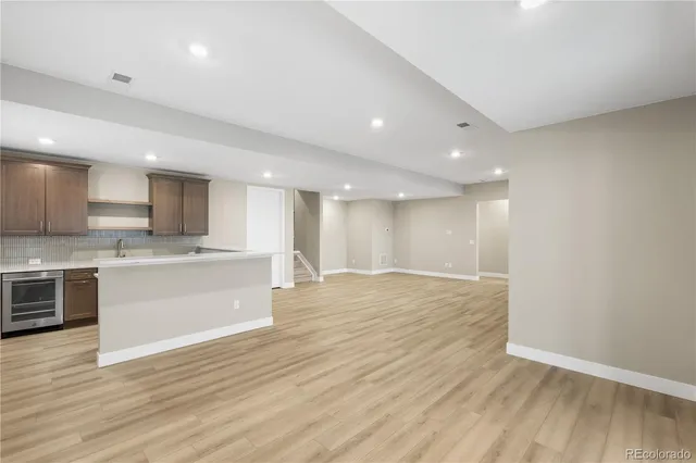 a view of kitchen with wooden floor