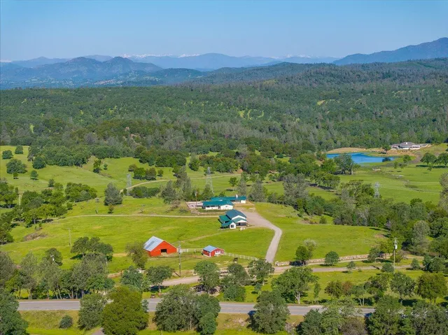 a view of a town with mountains in the background