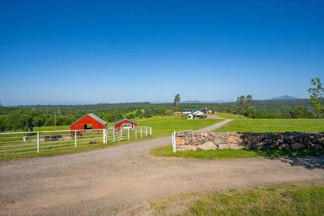 a kitchen with a dining table and chairs