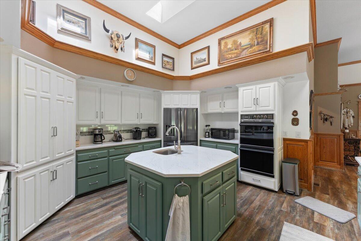 26602 Snider Ranch Road Oak Run, CA 96069 - Photo 28 of 97 a kitchen with stainless steel appliances granite countertop a refrigerator a stove and a sink