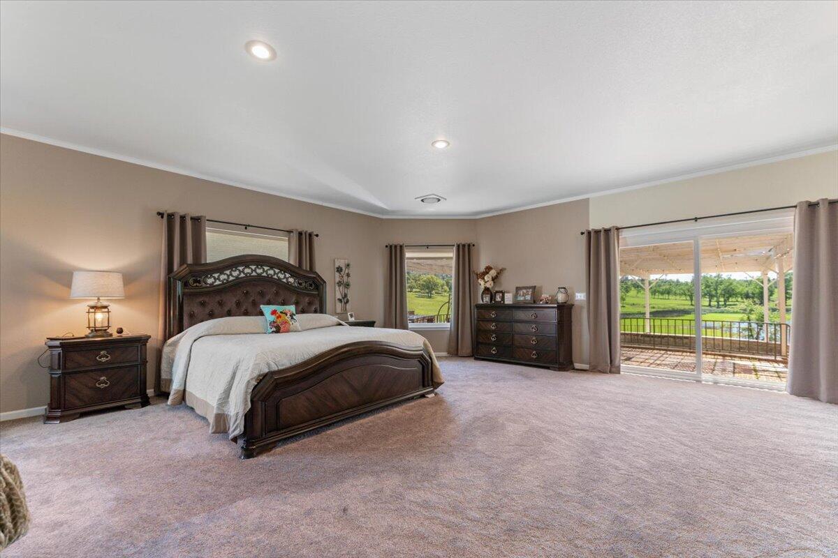 26602 Snider Ranch Road Oak Run, CA 96069 - Photo 36 of 97 a spacious bedroom with a bed and a large window
