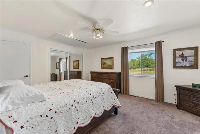 a view of a backyard with swimming pool and wooden fence