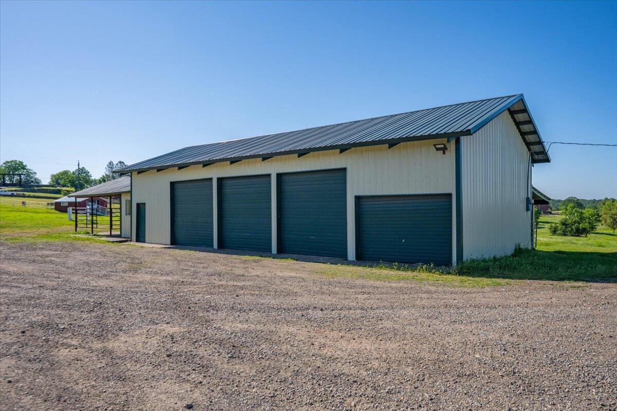 26602 Snider Ranch Road Oak Run, CA 96069 - Photo 64 of 97 a front view of a house with a yard and garage