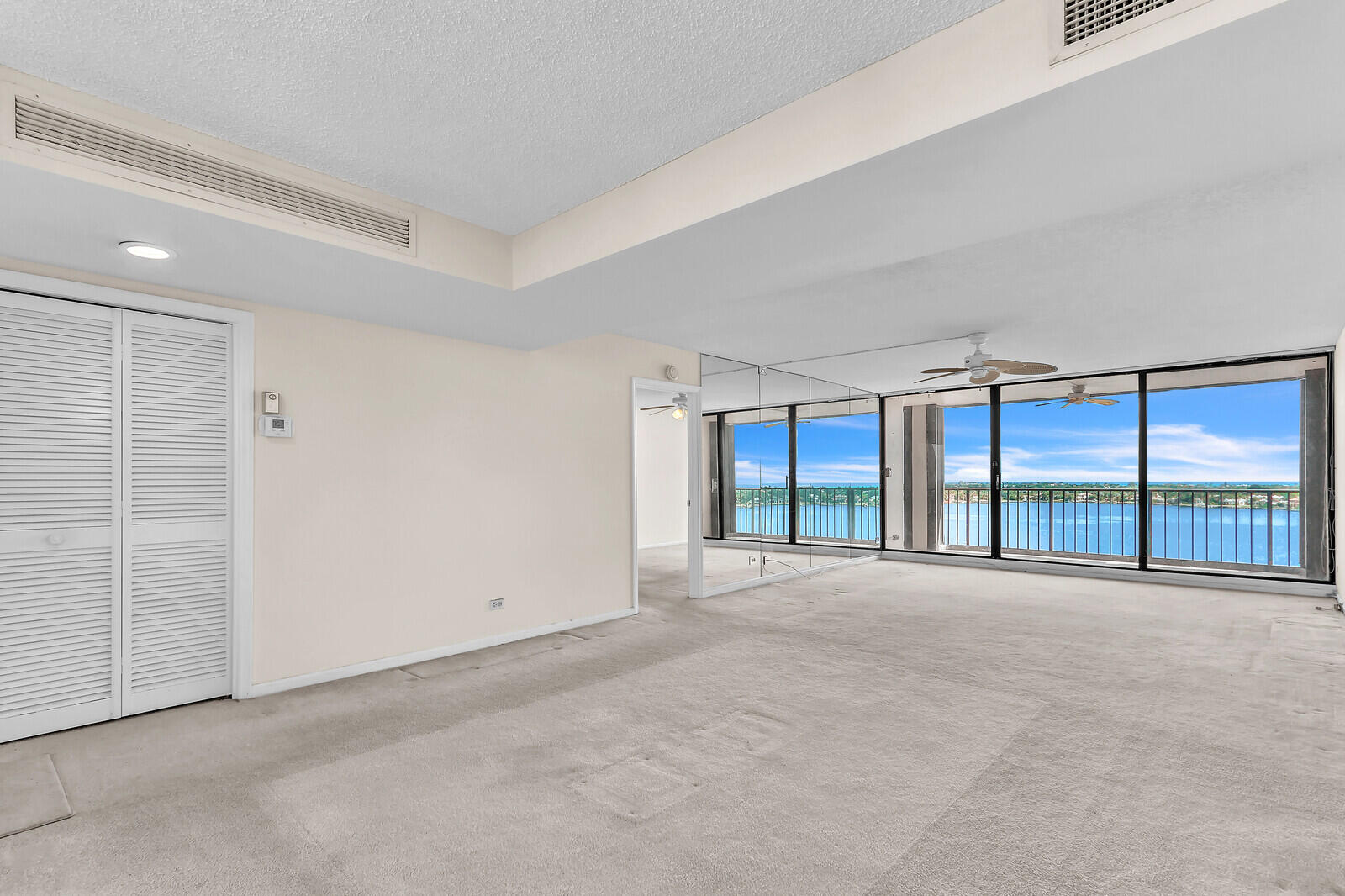 132 Lakeshore Drive, Unit 1117 North Palm Beach, FL 33408 - Photo 34 of 35 a view of an empty room with a balcony