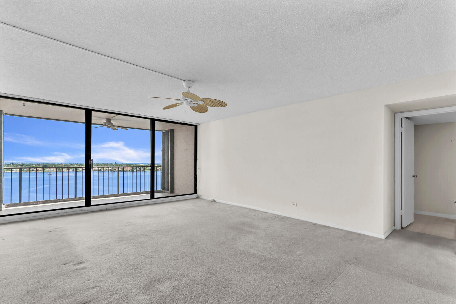 132 Lakeshore Drive, Unit 1117 North Palm Beach, FL 33408 - Photo 35 of 35 wooden floor in an empty room with a large window