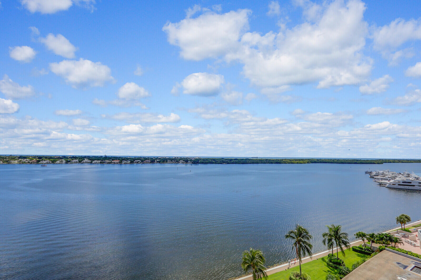 132 Lakeshore Drive, Unit 1117 North Palm Beach, FL 33408 - Photo 4 of 35 a view of a lake and mountain in the back