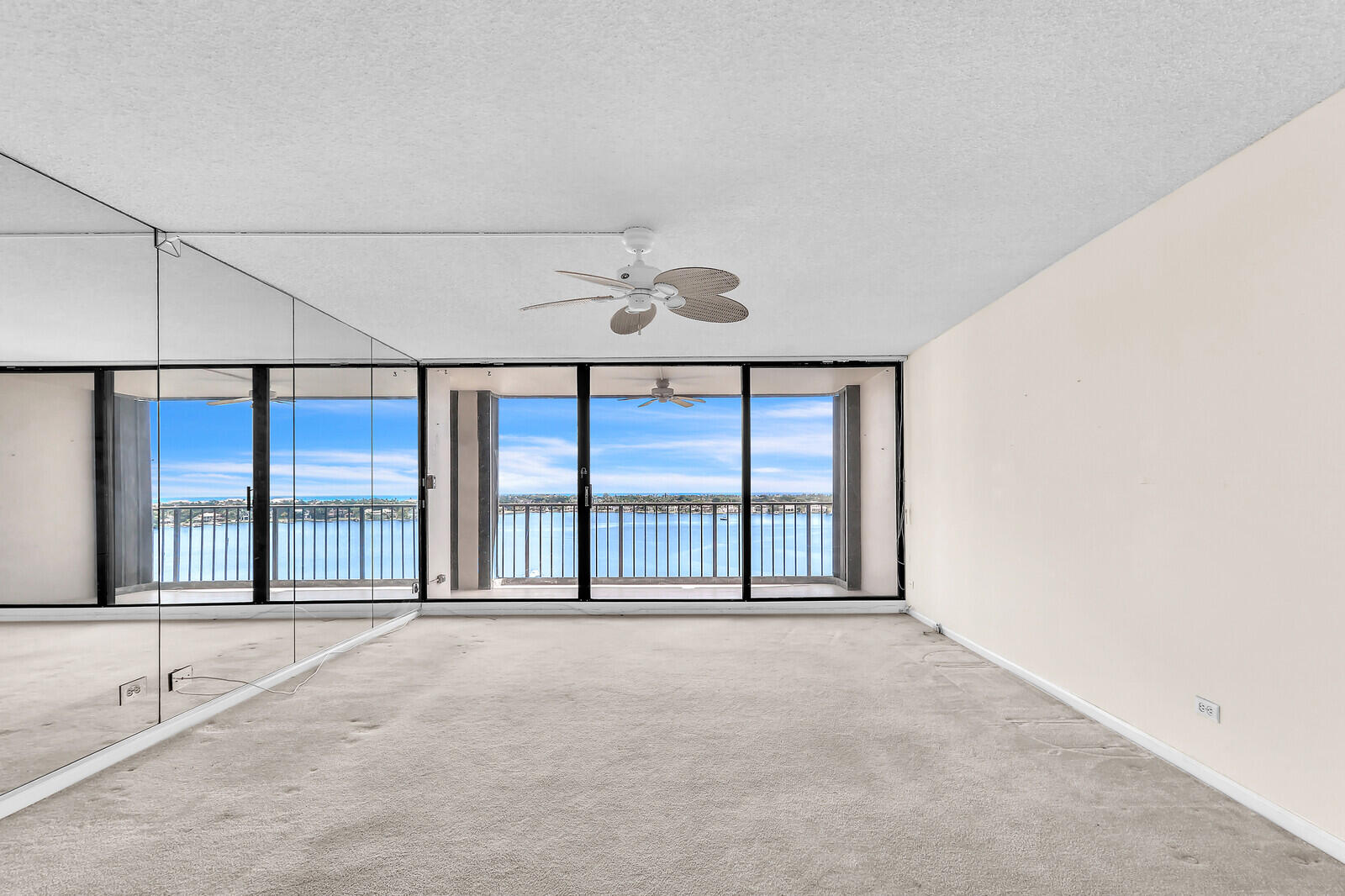 132 Lakeshore Drive, Unit 1117 North Palm Beach, FL 33408 - Photo 6 of 35 a view of an empty room with a large window