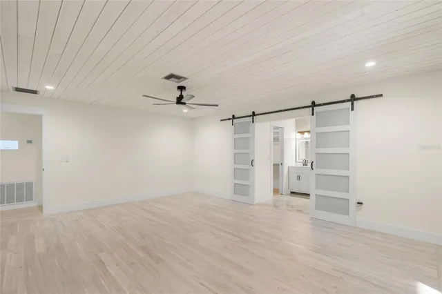 a view of an empty room with a window