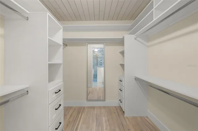 a view of room with window and hardwood floor