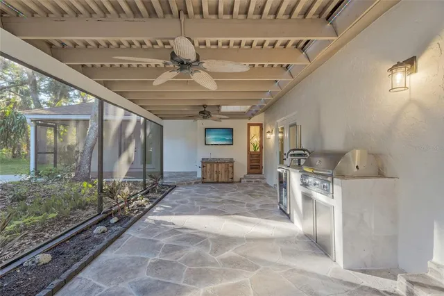 a view of a patio with couches and a big yard