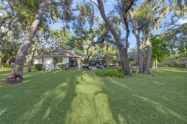 a view of a house with a yard and garage