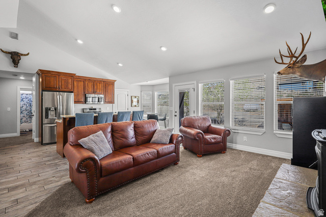 1588 West Rim Rock Drive Stockton, UT 84071 - Photo 9 of 61 Vaulted ceilings complement the open-concept living space, featuring recessed lighting and light gray wall paint