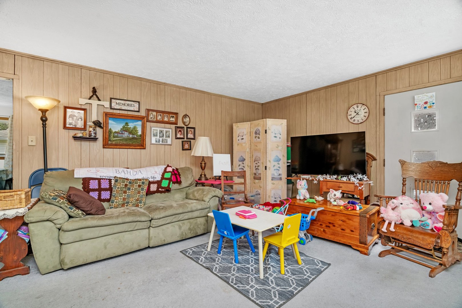 107 North Elm Street Gardner, IL 60424 - Photo 16 of 40 a living room with furniture and a flat screen tv