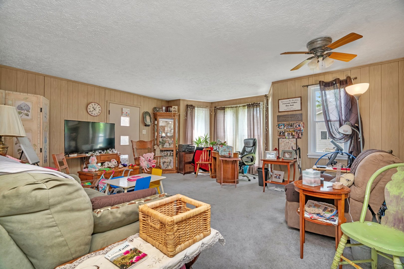 107 North Elm Street Gardner, IL 60424 - Photo 17 of 40 a living room filled with furniture and a window