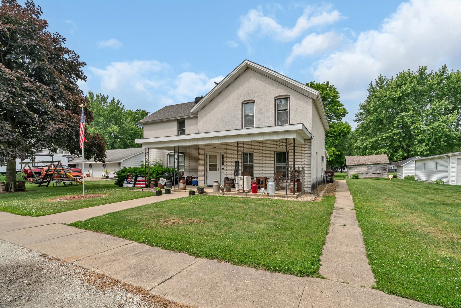 107 North Elm Street Gardner, IL 60424 - Photo 2 of 40 a view of a house with a yard and sitting area