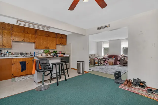 a room with gym equipment and view of living room