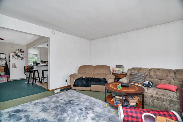 a living room with furniture and a rug