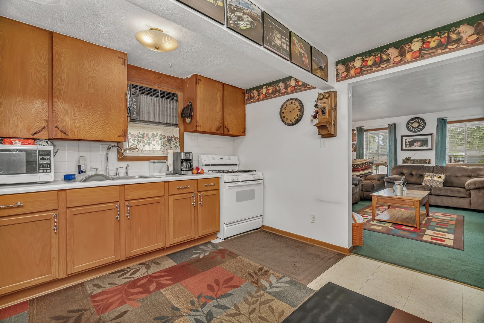 107 North Elm Street Gardner, IL 60424 - Photo 35 of 40 a kitchen with stainless steel appliances granite countertop a sink and cabinets