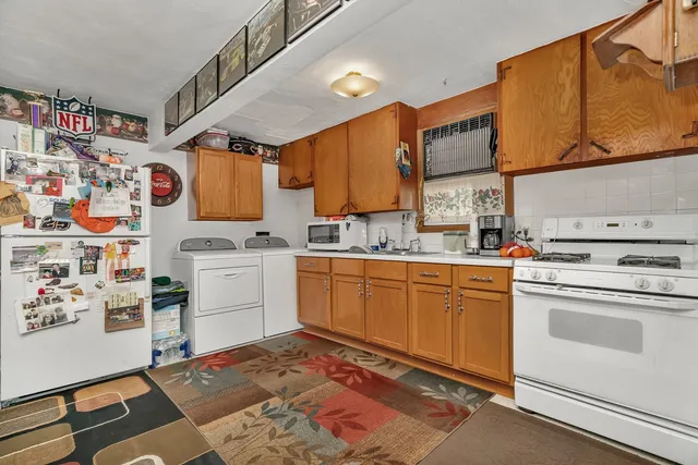 a kitchen with a refrigerator and cabinets