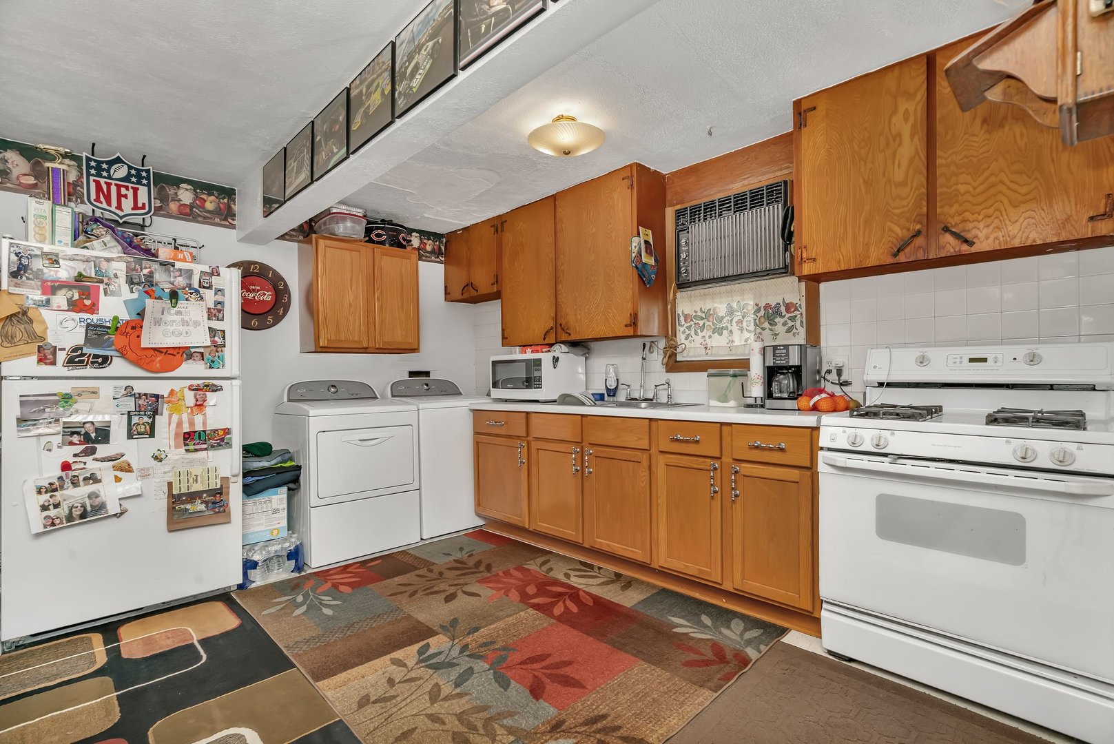 107 North Elm Street Gardner, IL 60424 - Photo 36 of 40 a kitchen with a refrigerator and cabinets