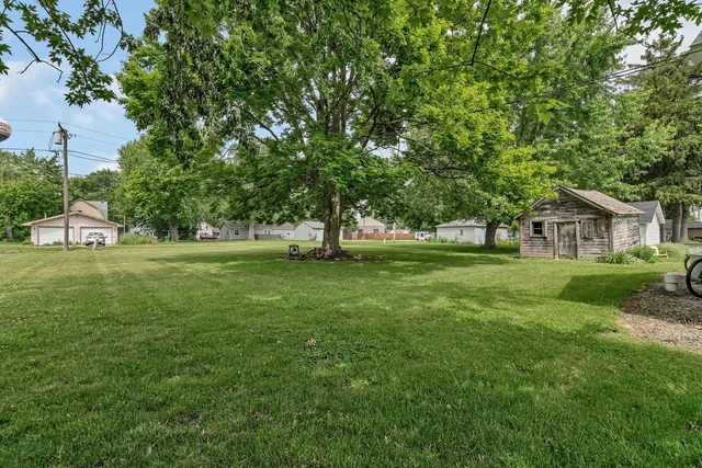 a view of house with yard