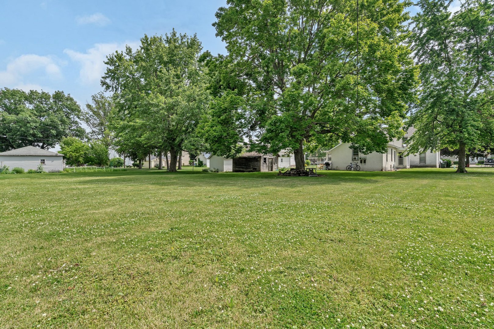 107 North Elm Street Gardner, IL 60424 - Photo 6 of 40 a view of a field with tree in front of it