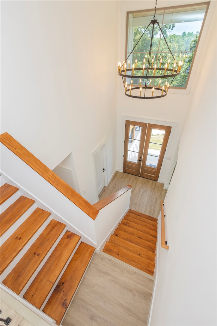 230 Hammond Circle Anderson, SC 29621 - Photo 40 of 48 This spacious entry features high ceilings and beautiful wood staircase leading to a welcoming front door.