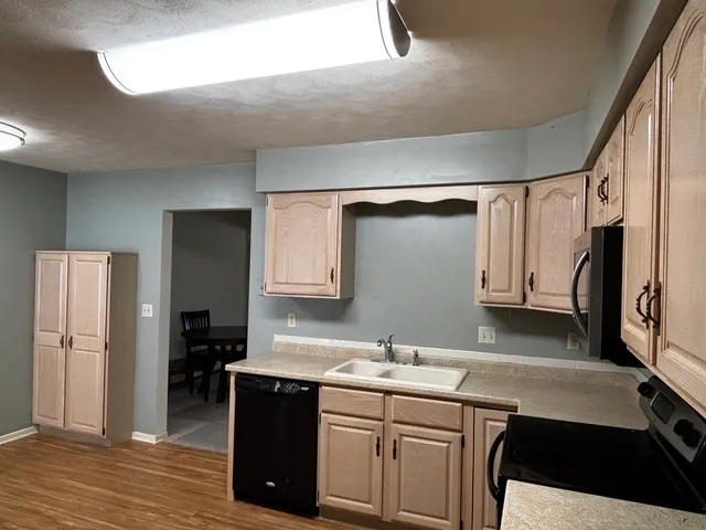 a view of an empty room with stairs