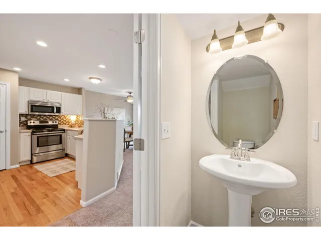 a en suite bathroom with a sink and a mirror