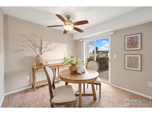 a dining room with furniture and window