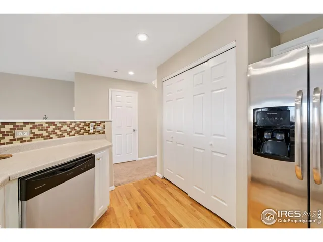 a view of kitchen with cabinets and wooden floor