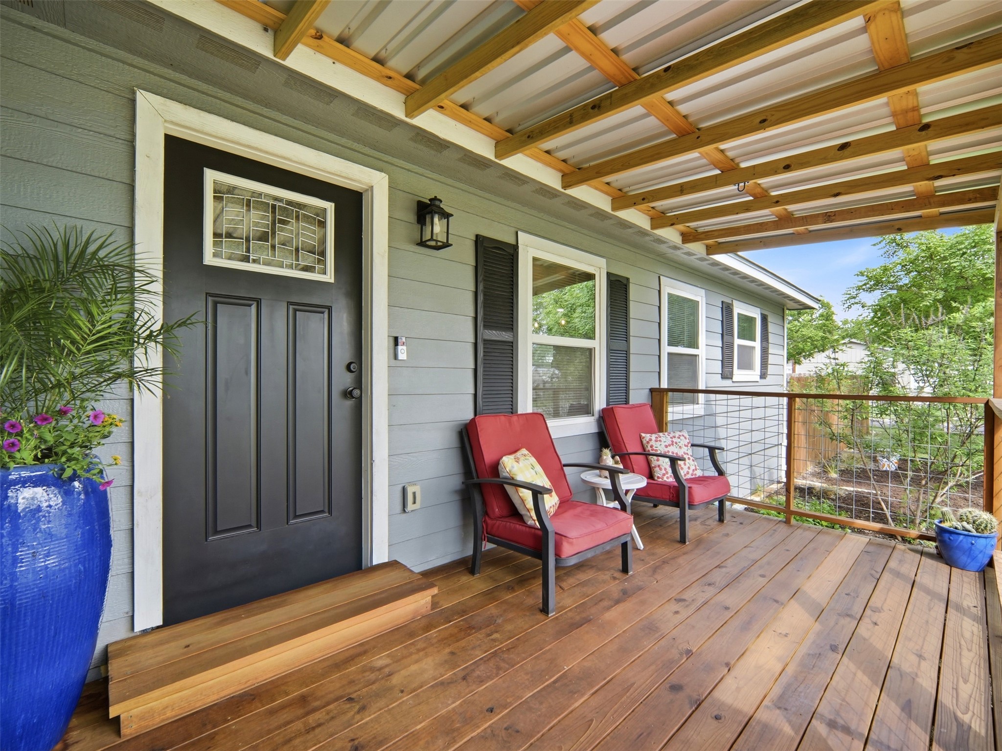 700 9th Street Blanco, TX 78606 - Photo 4 of 33 a balcony with furniture and wooden floor
