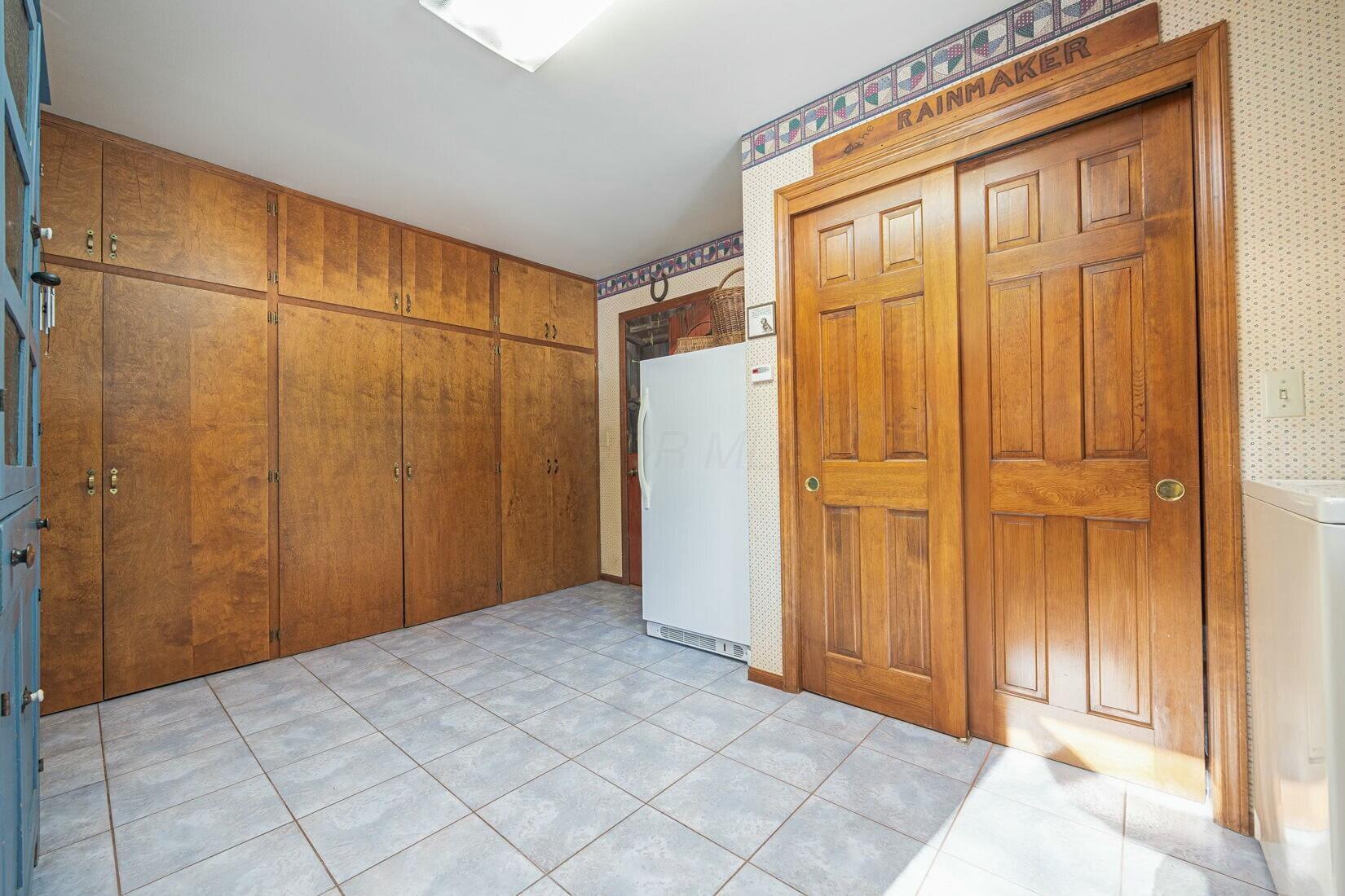 4446 Dublin Road Columbus, OH 43221 - Photo 26 of 62 Laundry room/mud room easy access from garage and kitchen with access to side yard.