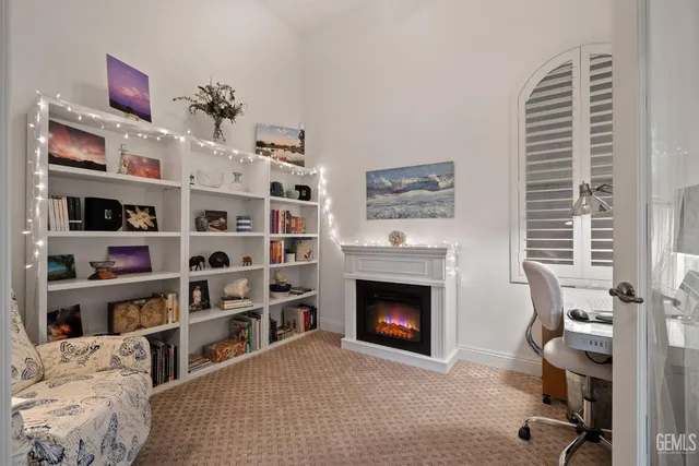 a bathroom with a granite countertop sink a mirror and shower