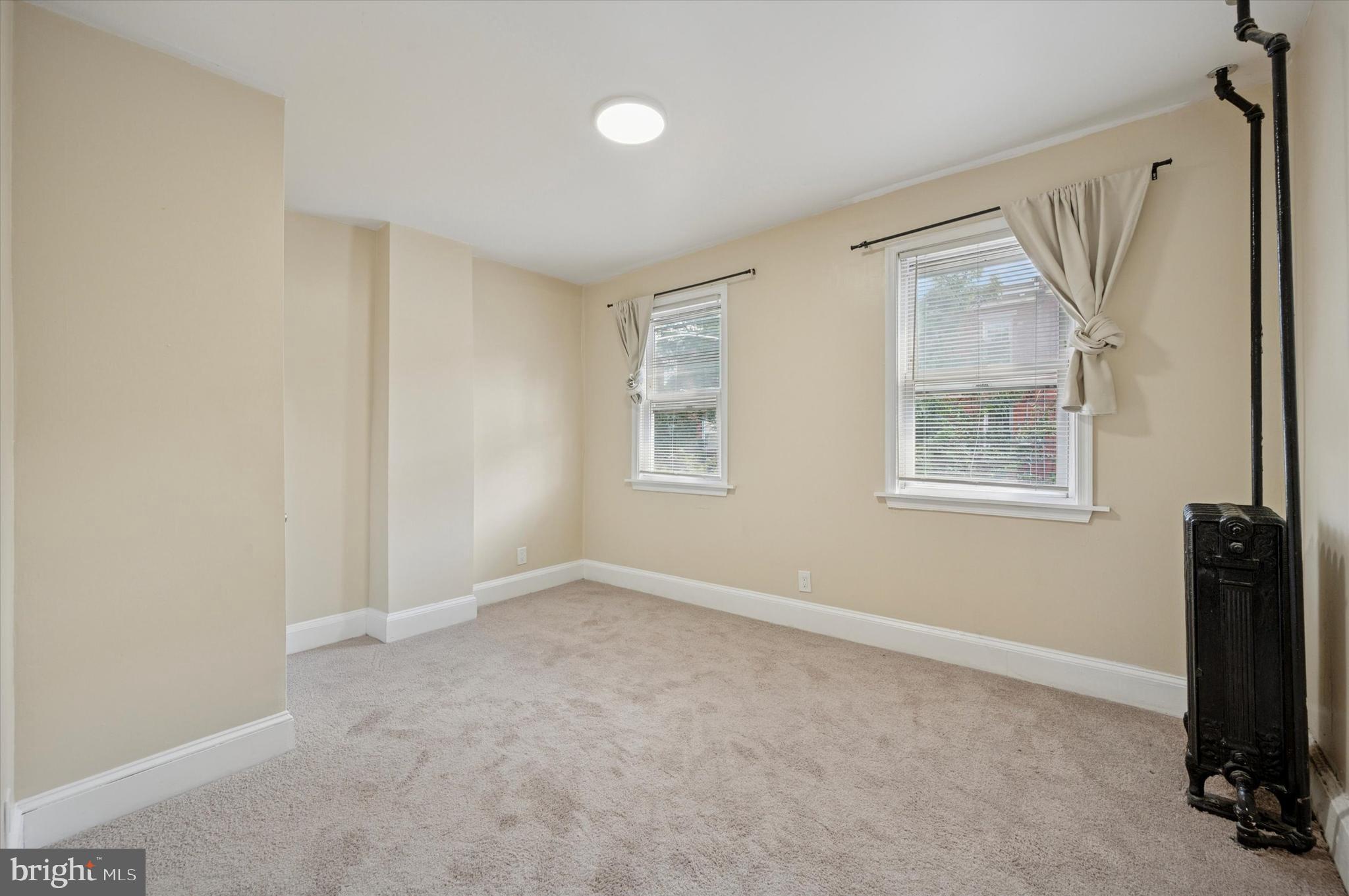 837 Almond Street Philadelphia, PA 19125 - Photo 14 of 24 an empty room with windows and closet