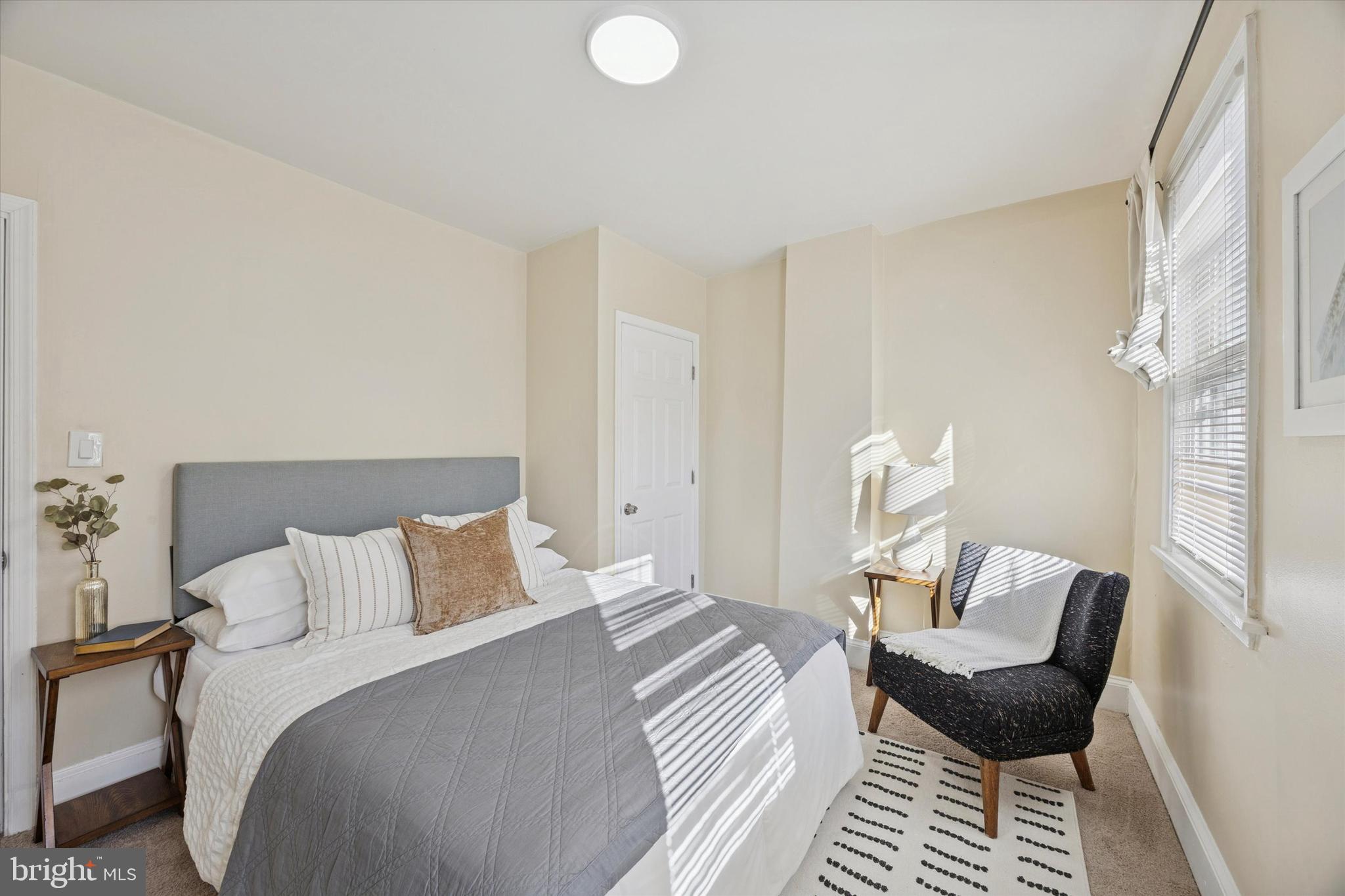 837 Almond Street Philadelphia, PA 19125 - Photo 17 of 24 a bedroom with a bed and chair