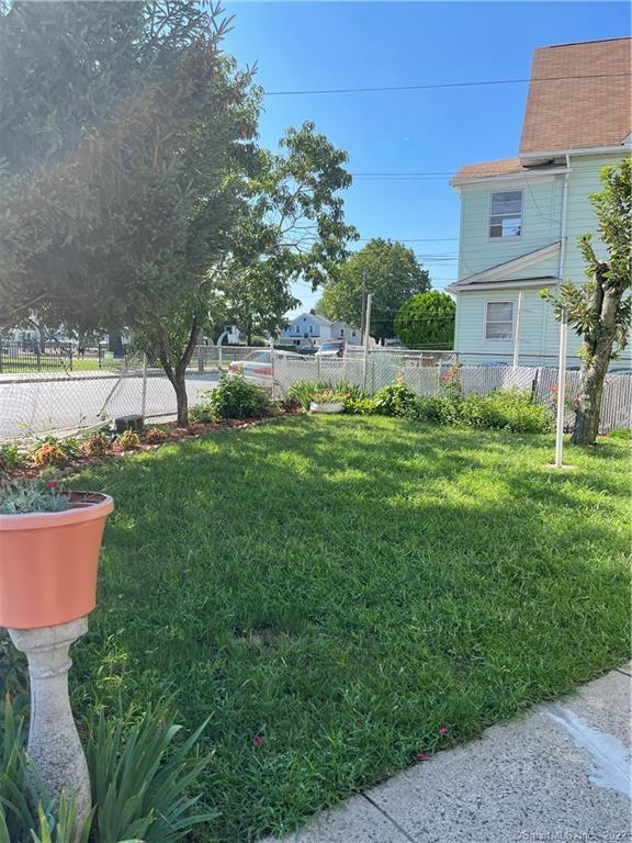 115 Oak Street, Unit 1 Bridgeport, CT 06604 - Photo 3 of 19 a view of a backyard with plants and a garden