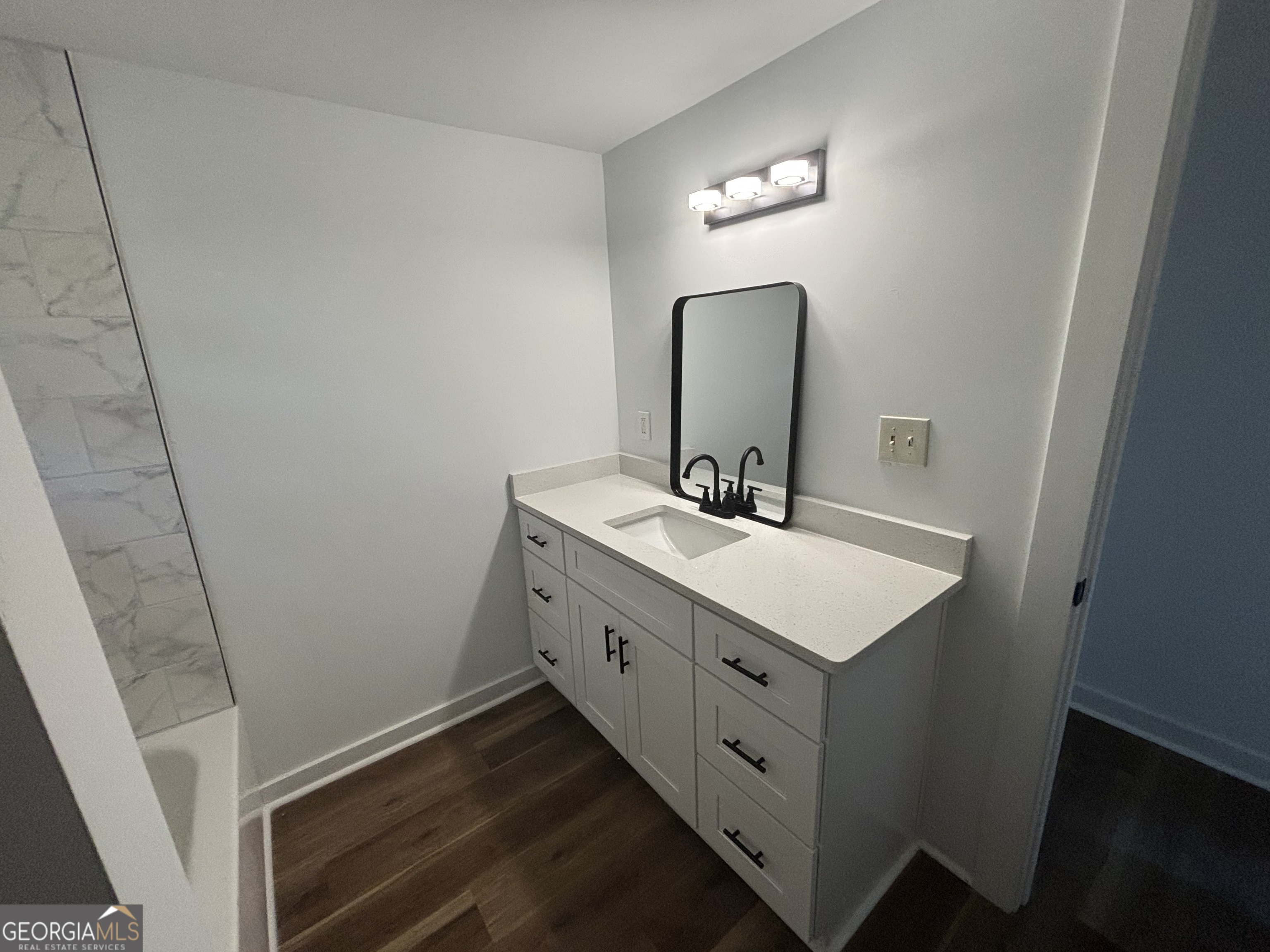 176 Randall Avenue Flovilla, GA 30216 - Photo 17 of 32 a bathroom with a sink and a mirror