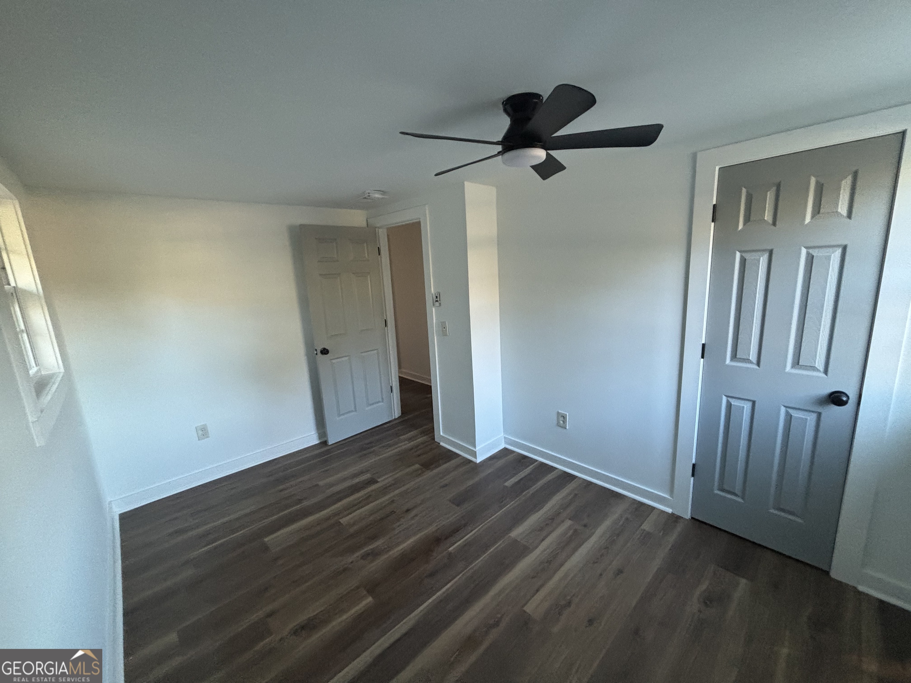176 Randall Avenue Flovilla, GA 30216 - Photo 20 of 32 a view of empty room with wooden floor