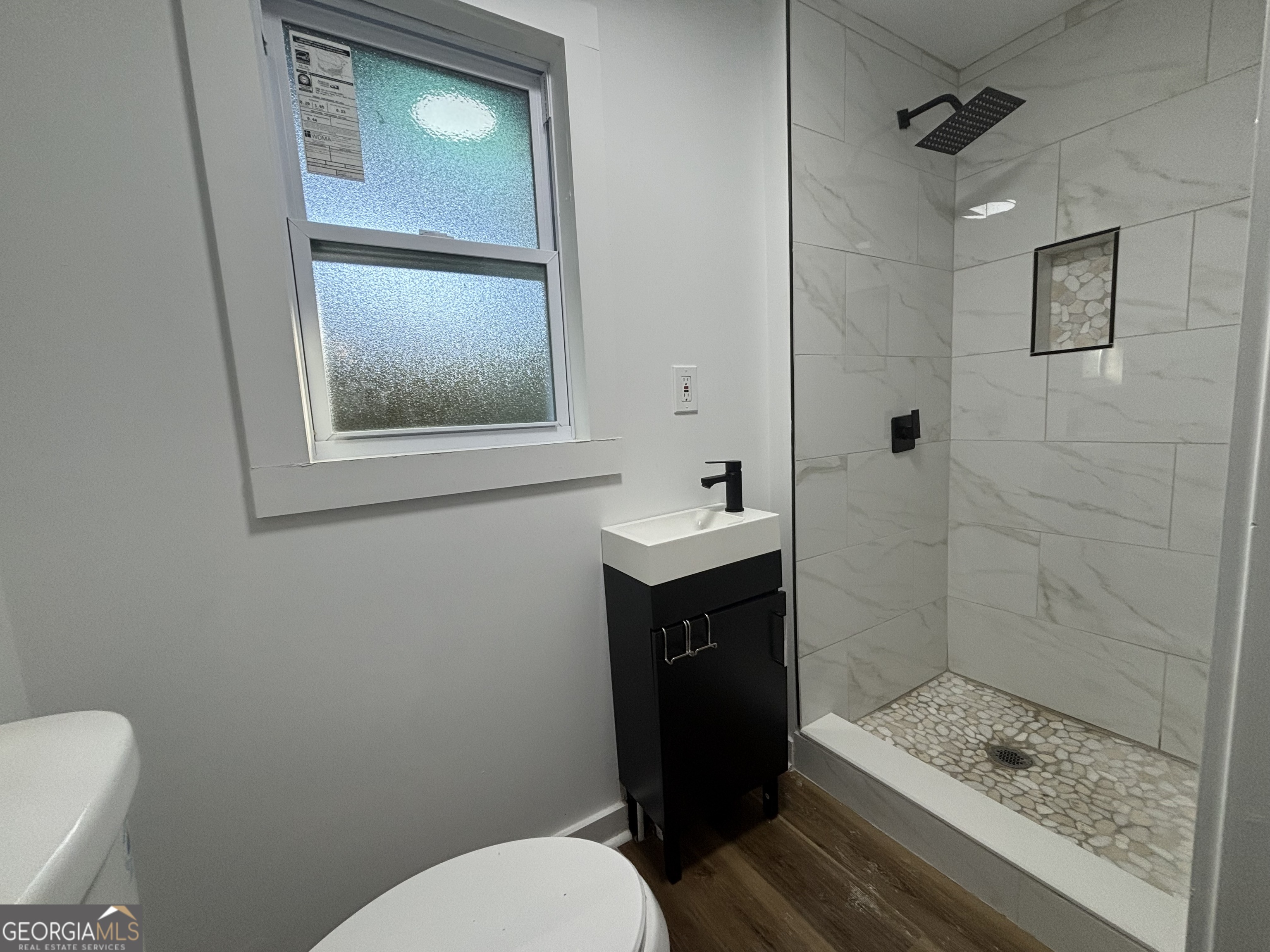 176 Randall Avenue Flovilla, GA 30216 - Photo 29 of 32 a bathroom with a toilet a sink and shower